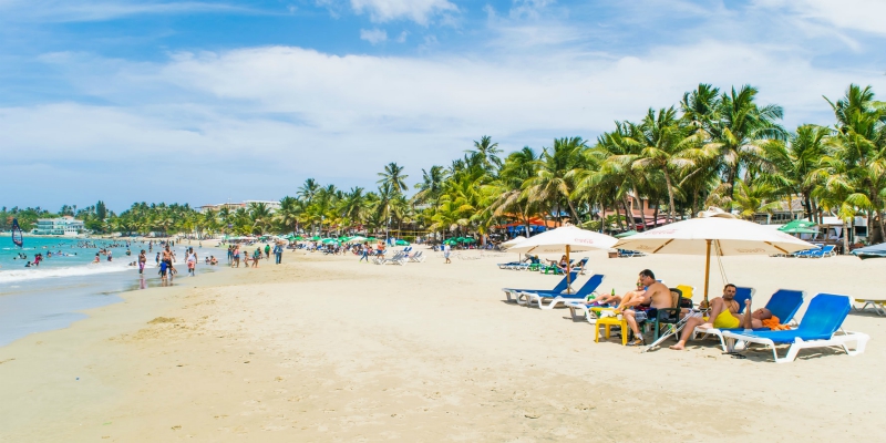People sunbathing on a beach in the Dominican Republic