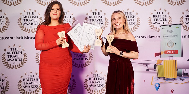 Two women pose with awards at the British Travel Awards 2023