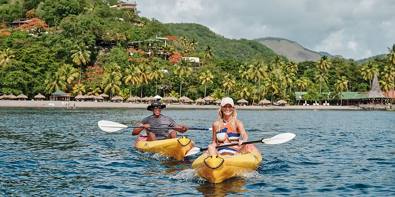 Couple kayaking in the Caribbean Sea around St Lucia