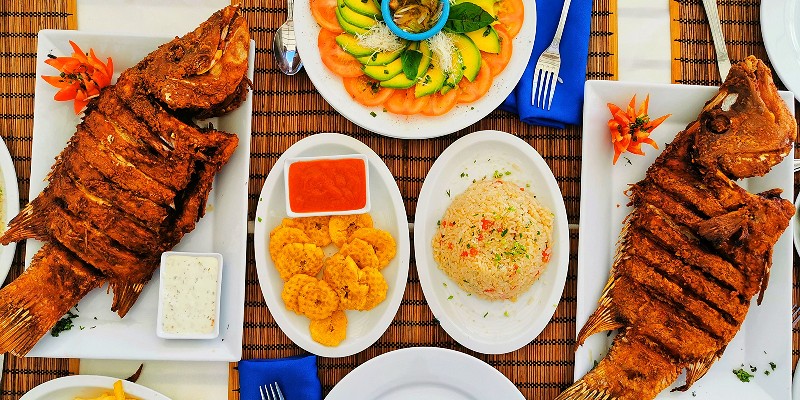 A selection of Dominican delicacies laid out on a table.