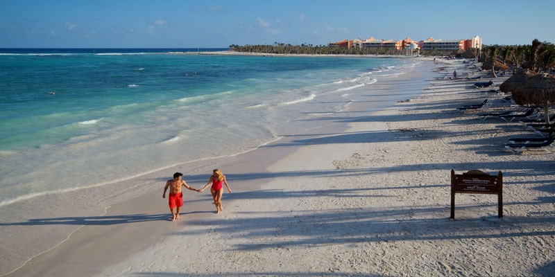 People walking on the beach at Grand Palladium Riviera Maya